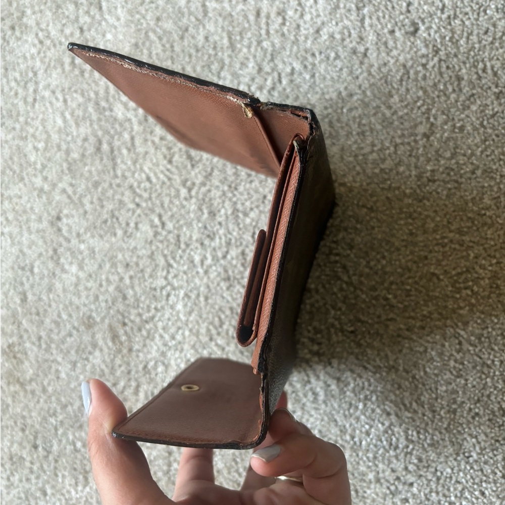 LV wallet pictures show the wear